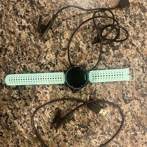 Garmin Forerunner 235 with two charges.